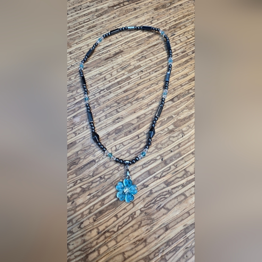 Handcrafted Black Beaded Necklace with Blue Flower Pendant